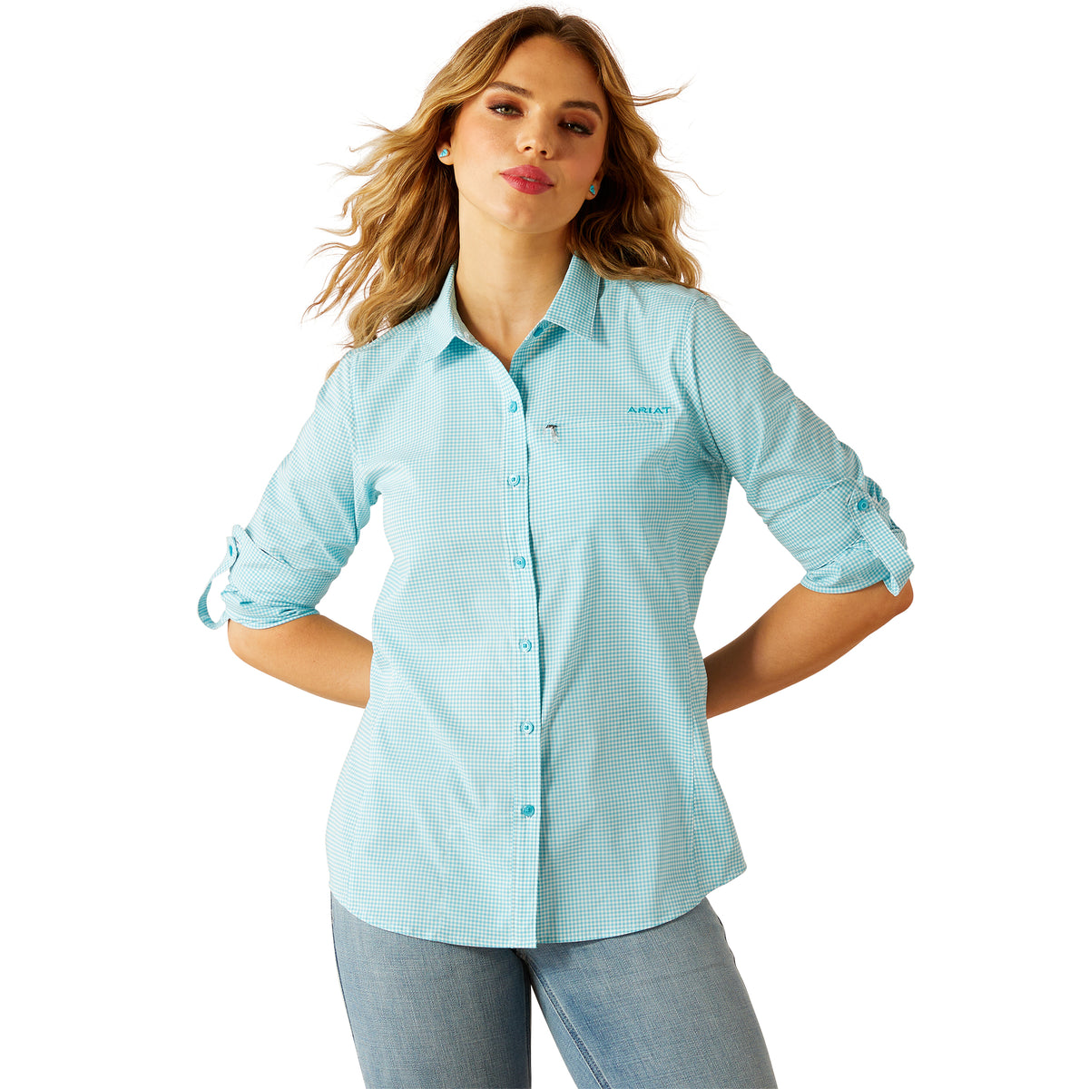Ariat Women&#39;s VentTEK L/S Western Shirt. Woman wearing a light blue checkered shirt with a logo on a white background