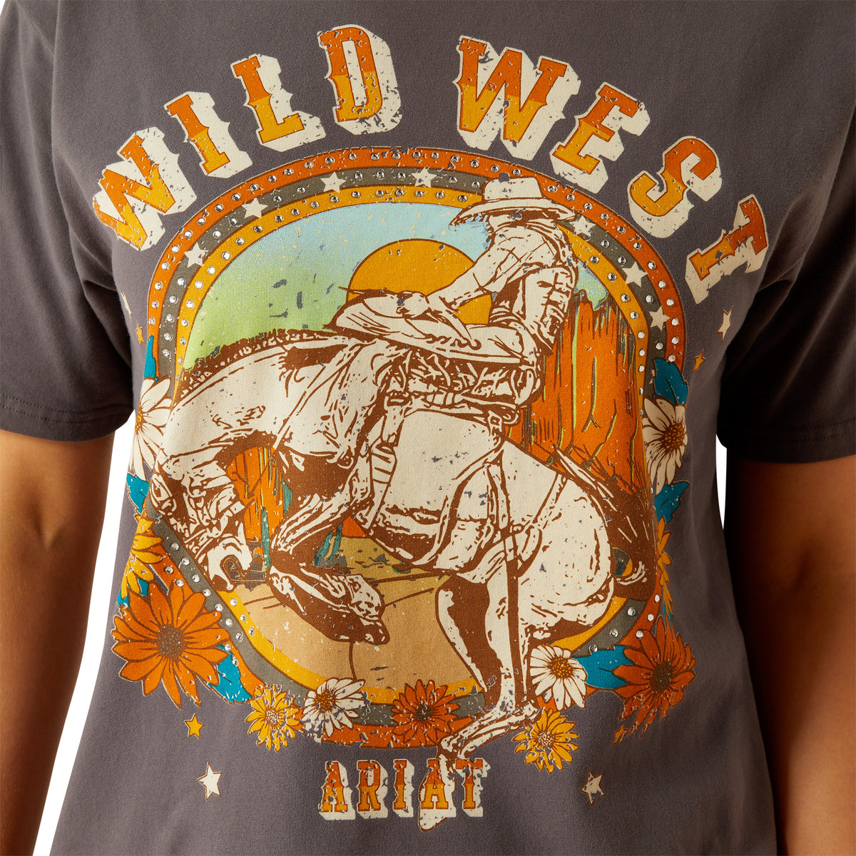 Ariat Women's Retro Rodeo T-Shirt. T-shirt with 'Wild West' and Ariat graphic design on a gray background