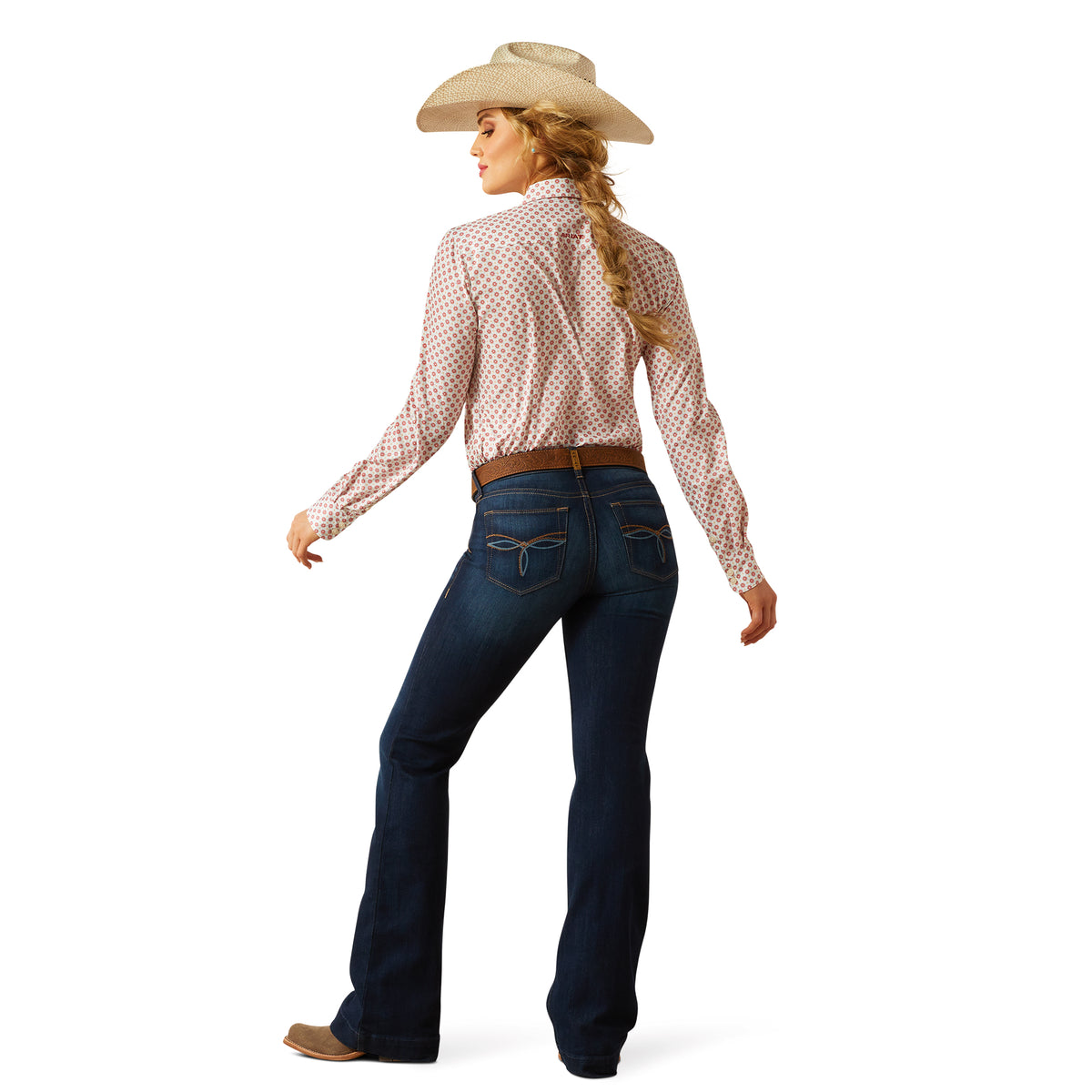 Ariat Women's Juliana Perfect Rise Trouser Jean. Woman wearing a checkered shirt, blue jeans, and a cowboy hat on a white background