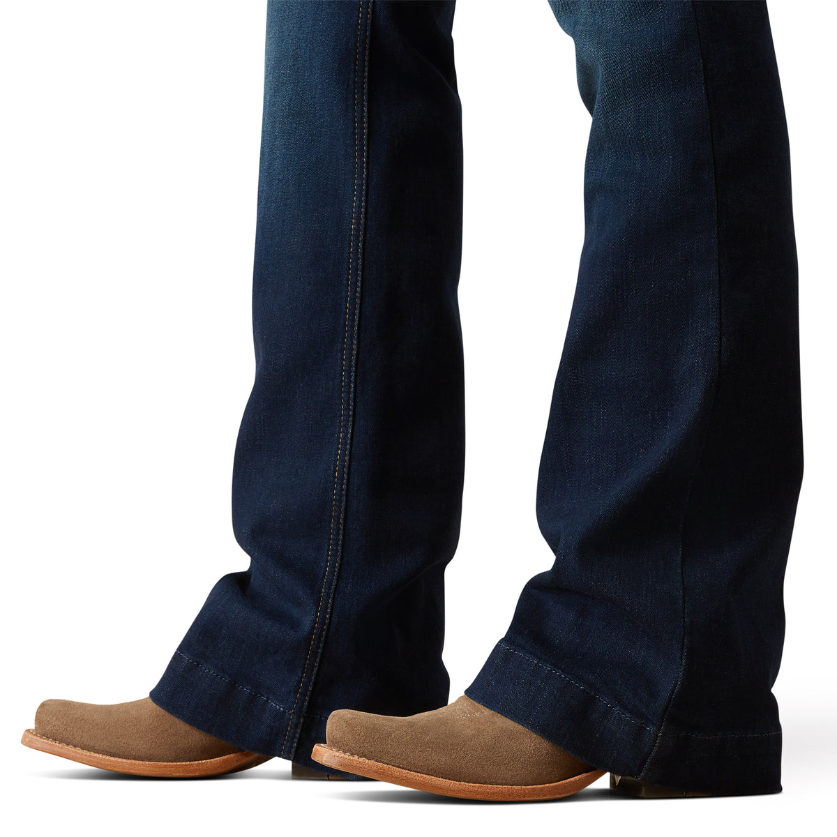 Ariat Women's Juliana Perfect Rise Trouser Jean. Close-up of dark blue jeans and brown shoes on a white background