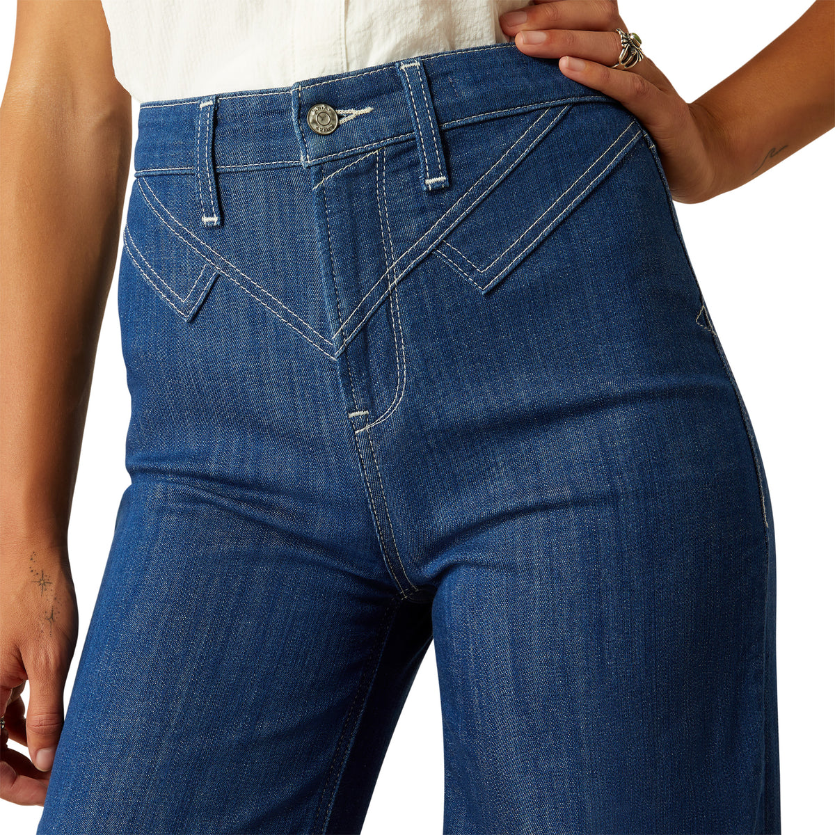 Ariat Women's Westie Ultra High-Rise Wide Leg Jean. Close-up of blue jeans on a white background