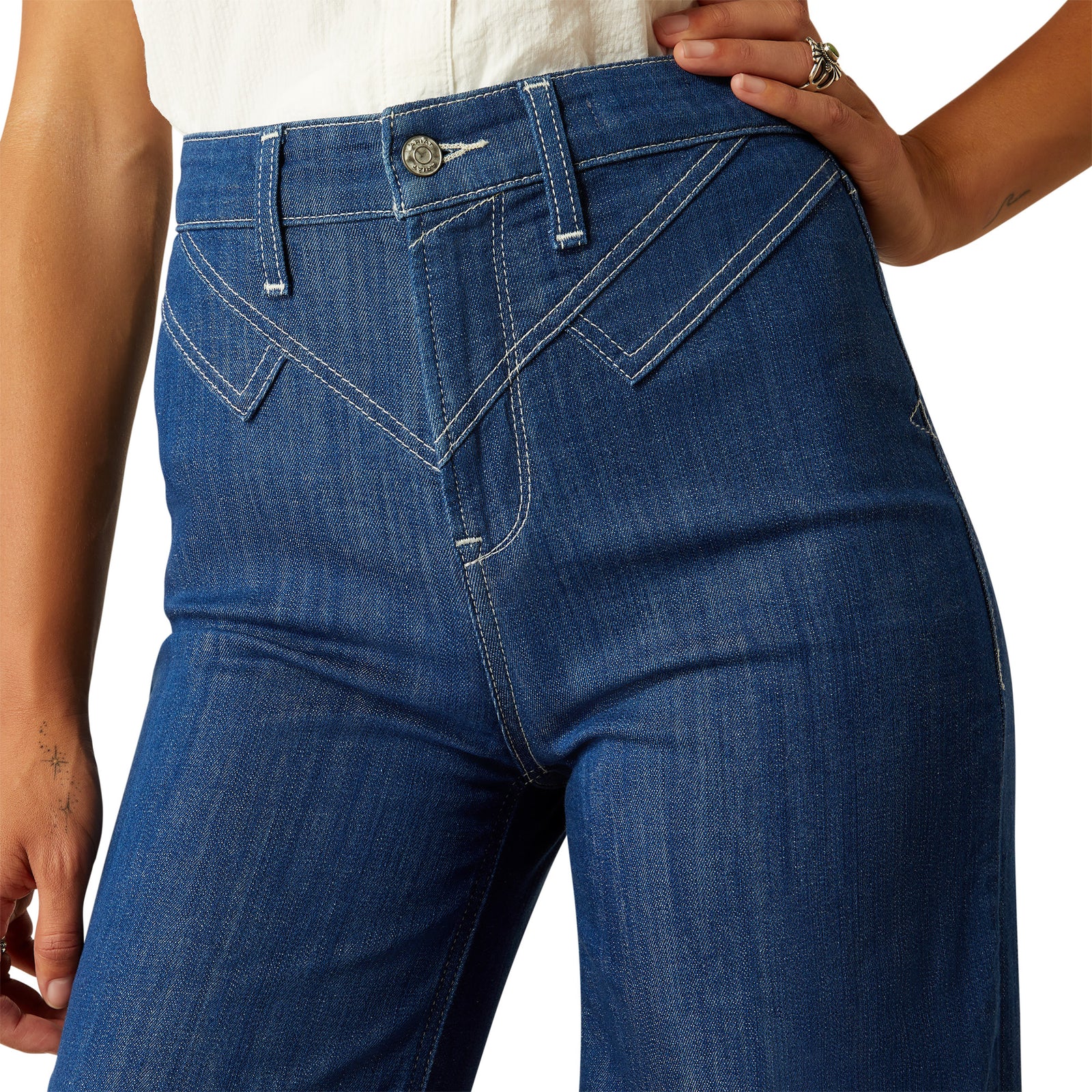 Ariat Women's Westie Ultra High-Rise Wide Leg Jean. Close-up of blue jeans on a white background