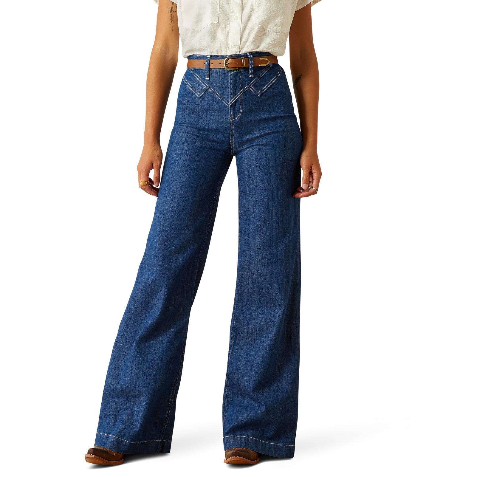 Ariat Women's Westie Ultra High-Rise Wide Leg Jean. Person wearing blue jeans with a white shirt on a white background