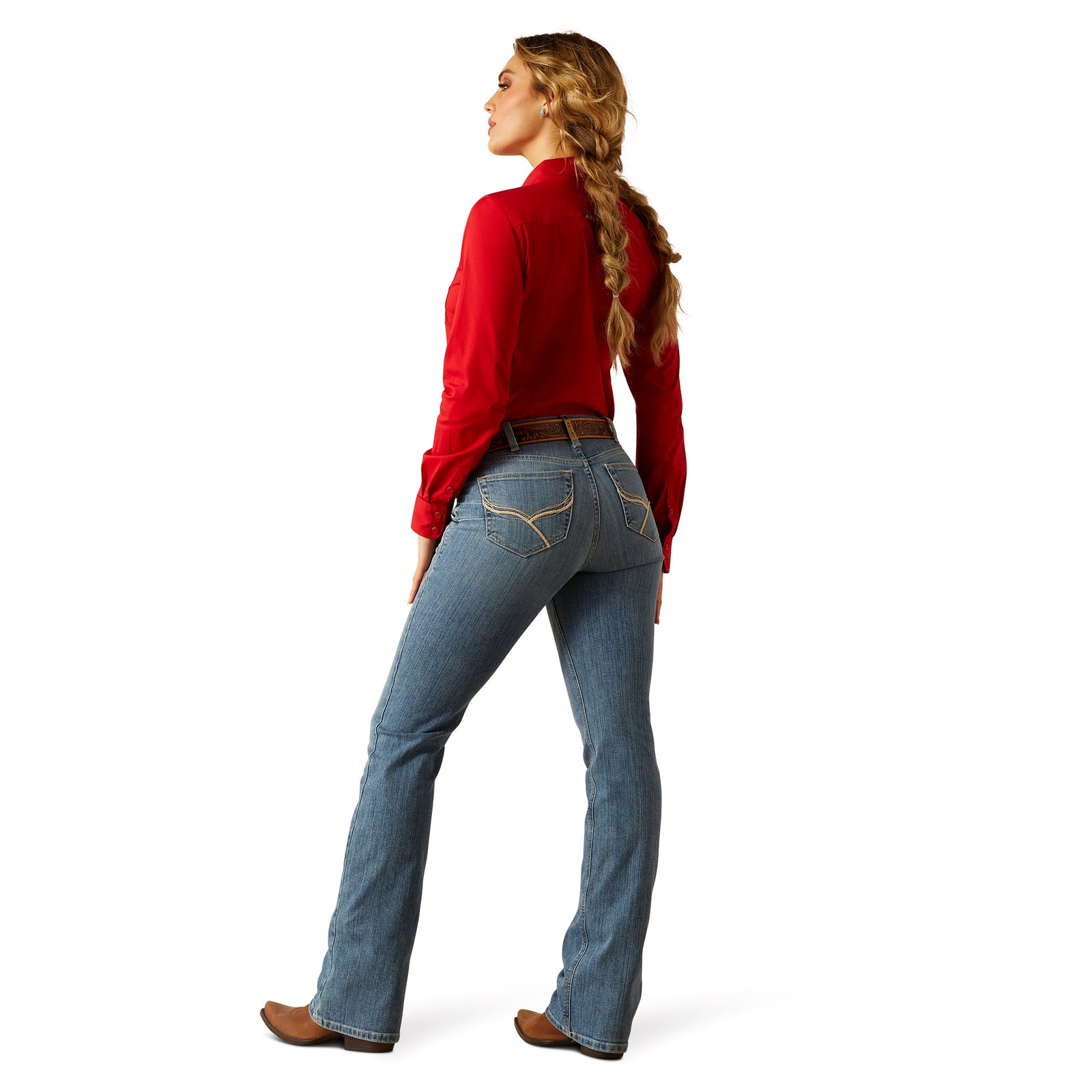 Ariat Women's Cecilia High Rise Boot Cut Jean. Person wearing blue jeans and a red shirt on a white background