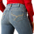 Ariat Women's Cecilia High Rise Boot Cut Jean. Blue jeans worn by a person with a red shirt on a white background