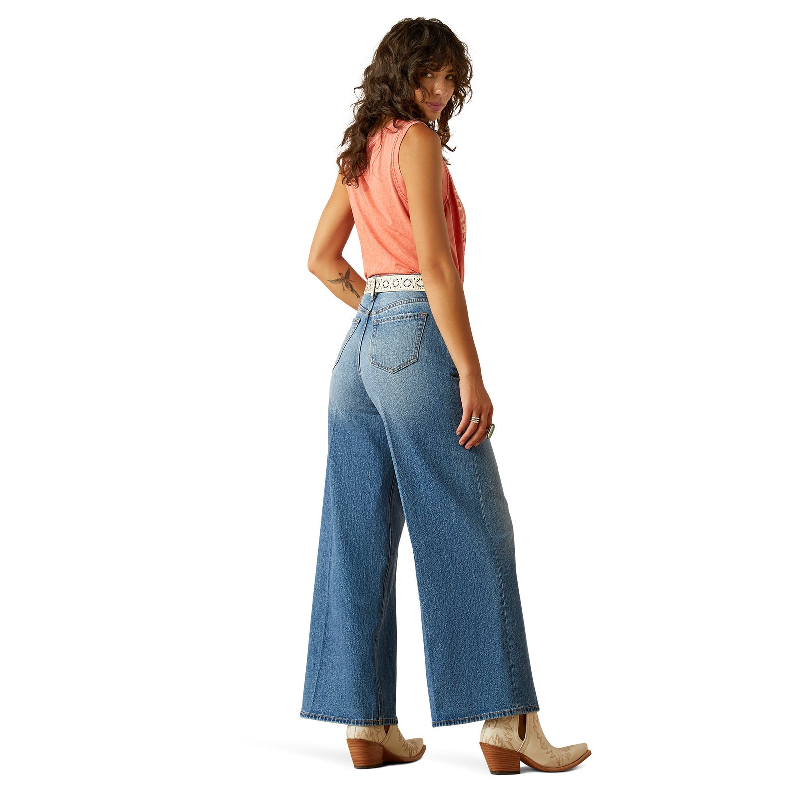 Ariat Women's Jazmine Ultra High-Rise Wide Leg Jean. Person wearing blue jeans and a red shirt on a white background