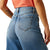 Ariat Women's Jazmine Ultra High-Rise Wide Leg Jean. Person wearing blue jeans and an orange top on a white background