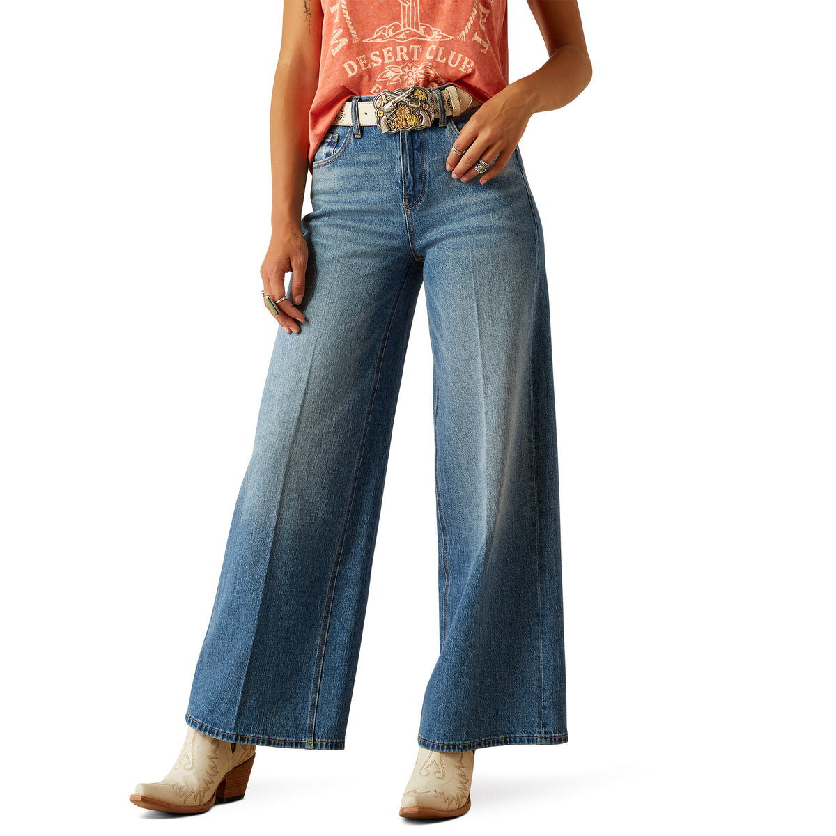 Ariat Women&#39;s Jazmine Ultra High-Rise Wide Leg Jean. Person wearing blue jeans and a red shirt on a white background