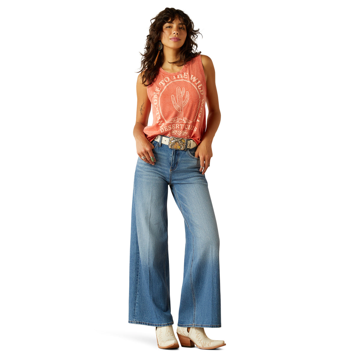 Ariat Women's Jazmine Ultra High-Rise Wide Leg Jean. Woman wearing a red tank top and blue jeans on a white background