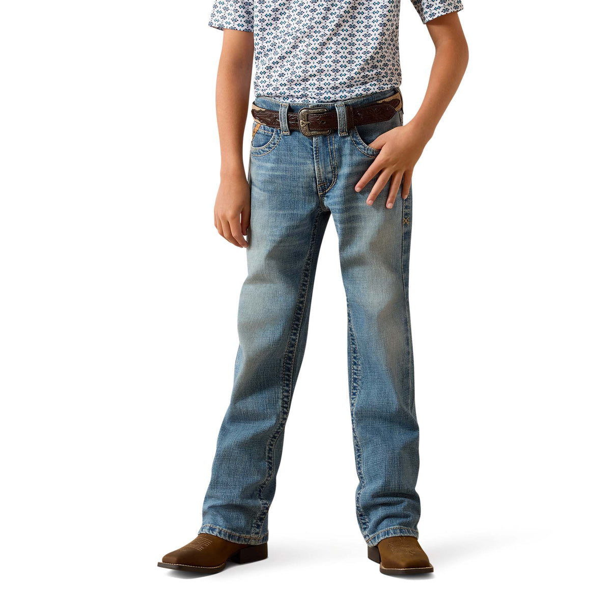 Person wearing blue jeans and a patterned shirt on a white background