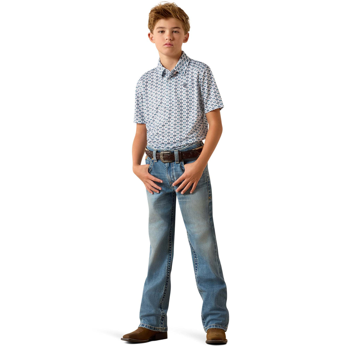 Young boy wearing a patterned shirt and blue jeans on a white background