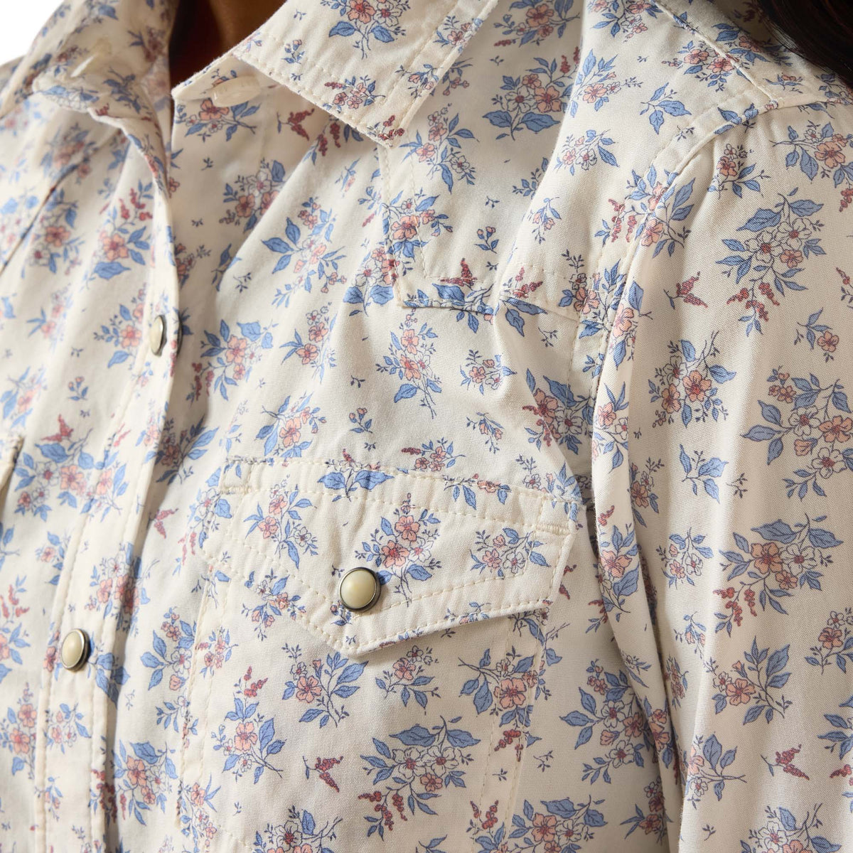 Floral patterned shirt with a focus on the fabric texture and design.