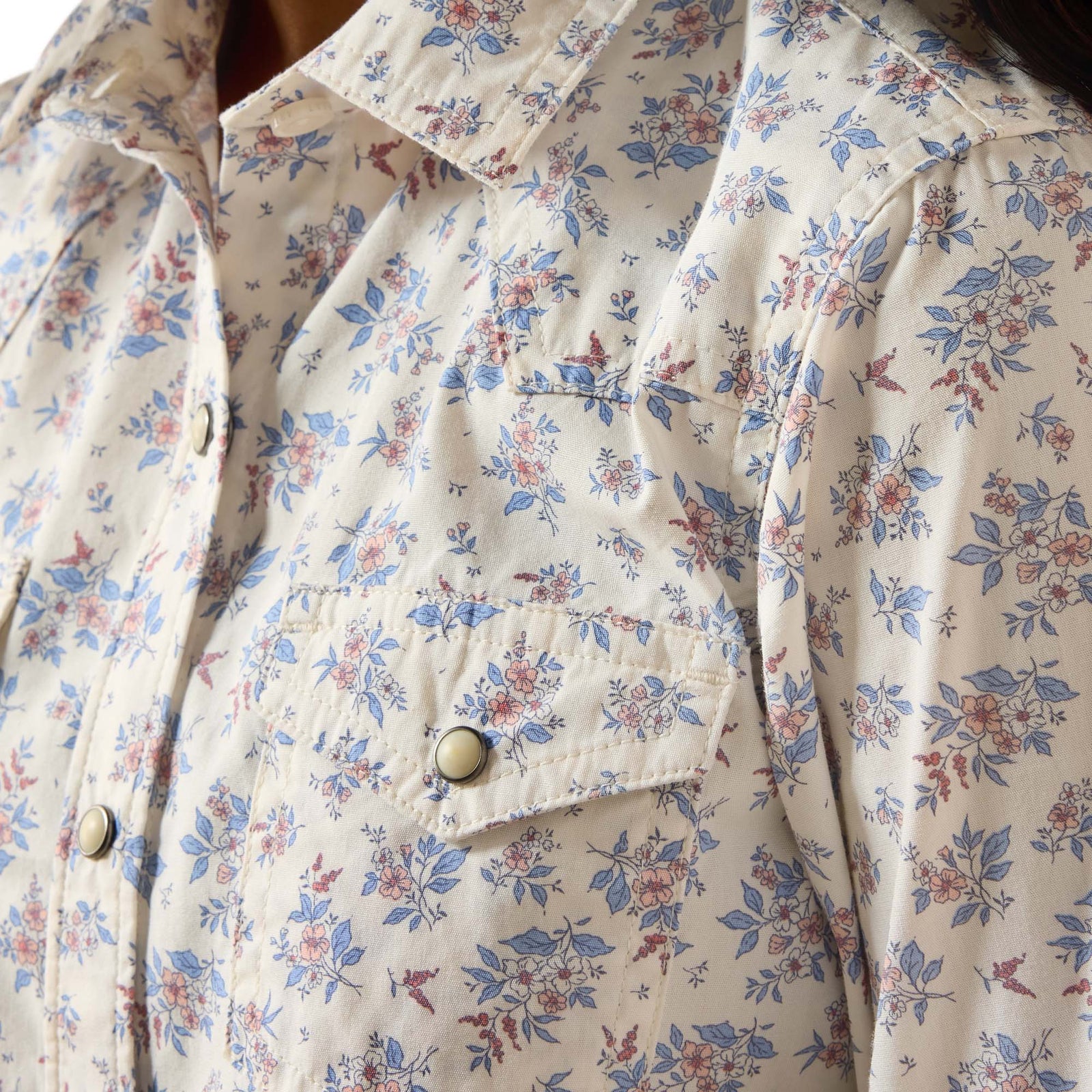 Floral patterned shirt with a focus on the fabric texture and design.
