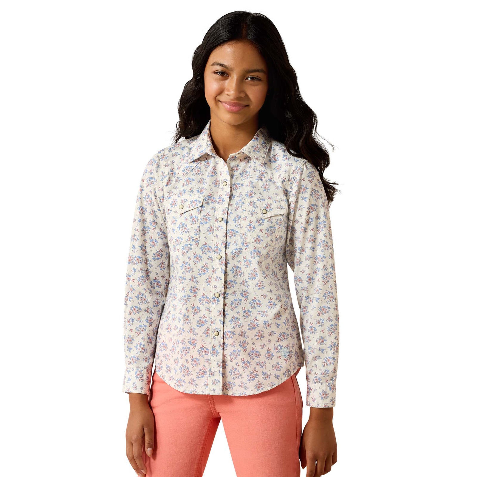 Woman wearing a floral shirt and pink pants on a white background