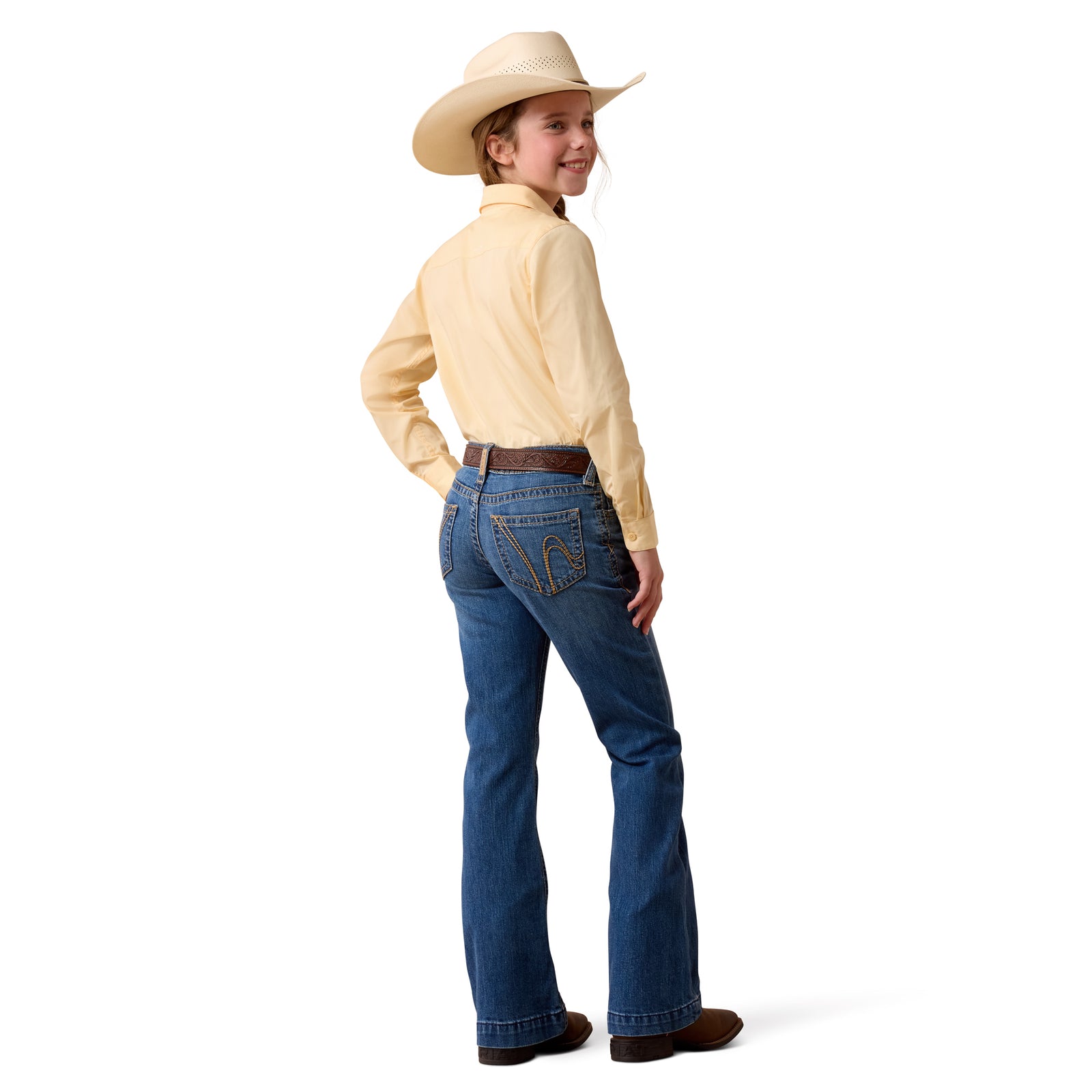 Person wearing a yellow shirt, blue jeans, and a cowboy hat on a white background