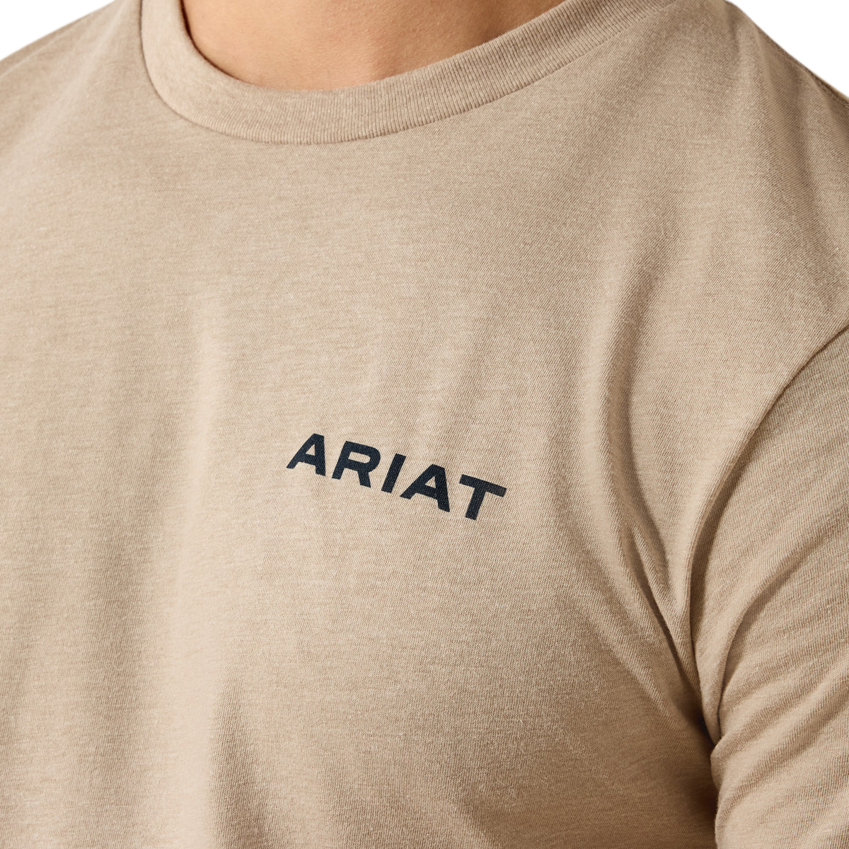 Beige shirt with 'ARIAT' logo on a white background