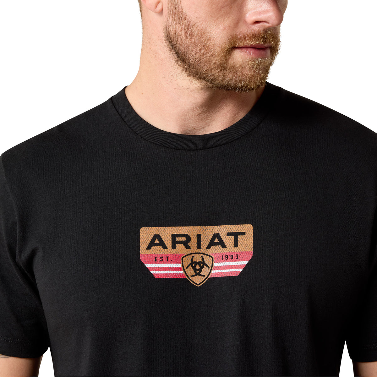 Person wearing a black t-shirt with Ariat logo