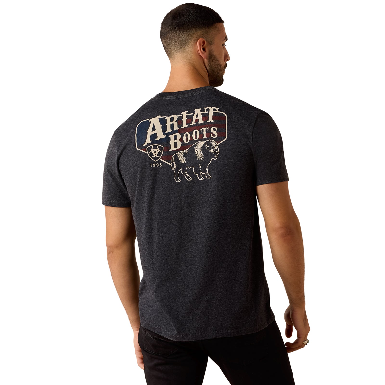 Man wearing a black t-shirt with 'Ariat Boots' logo on the back, standing against a white background