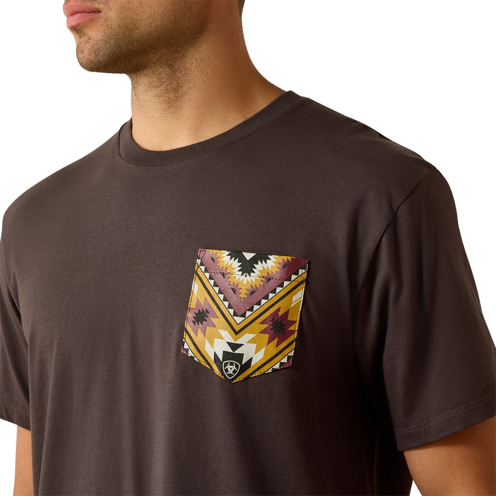 Brown t-shirt with a colorful geometric pocket design on a white background