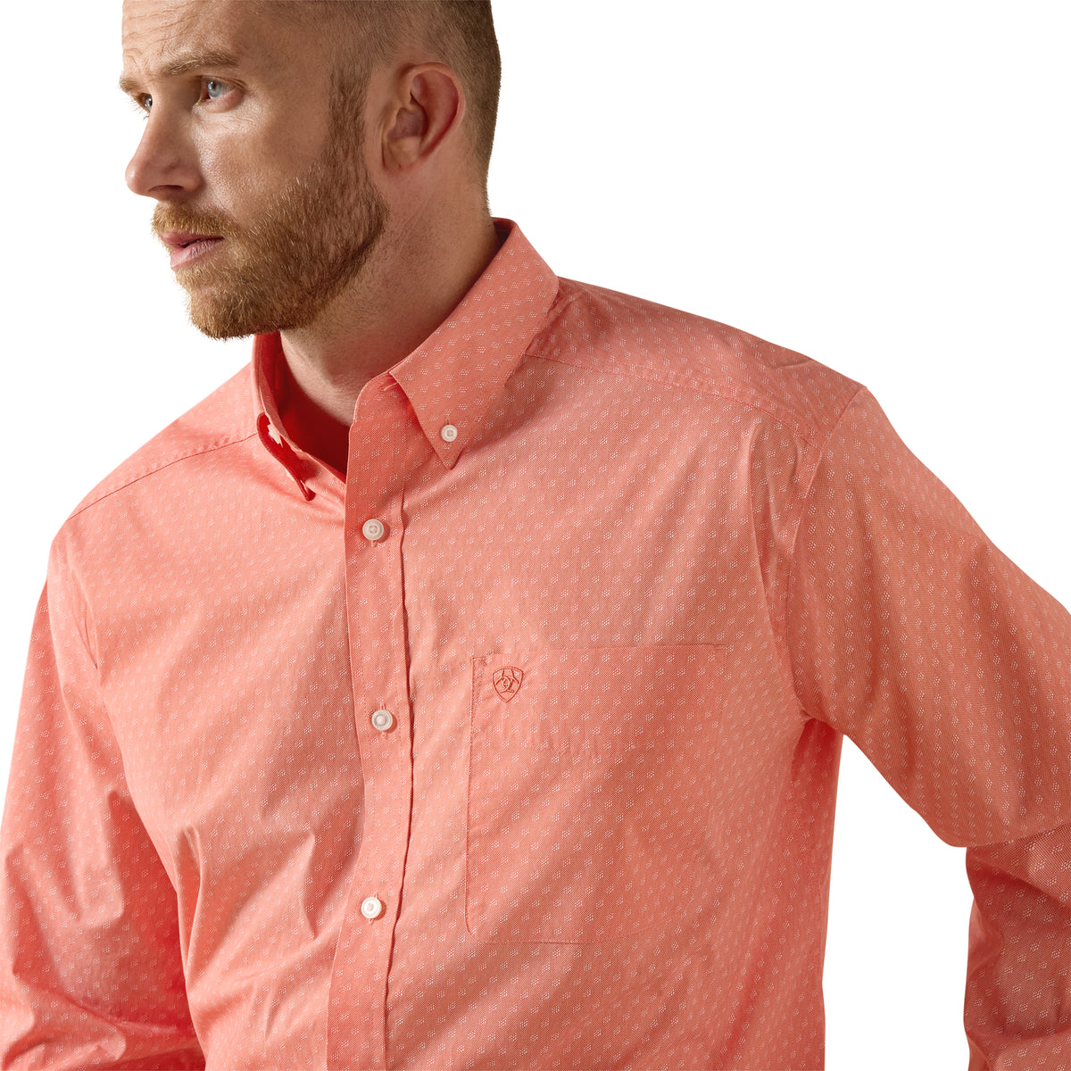 Man wearing a coral pink shirt on a white background