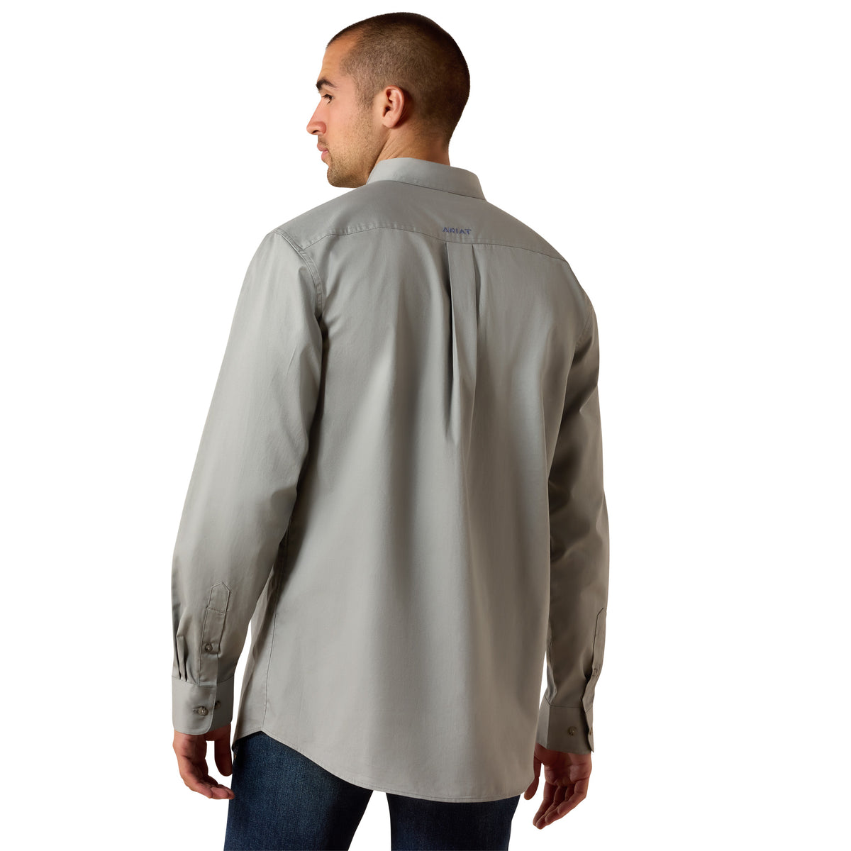 A man wearing a light gray long-sleeve button-down shirt, shown from the back against a plain white background.