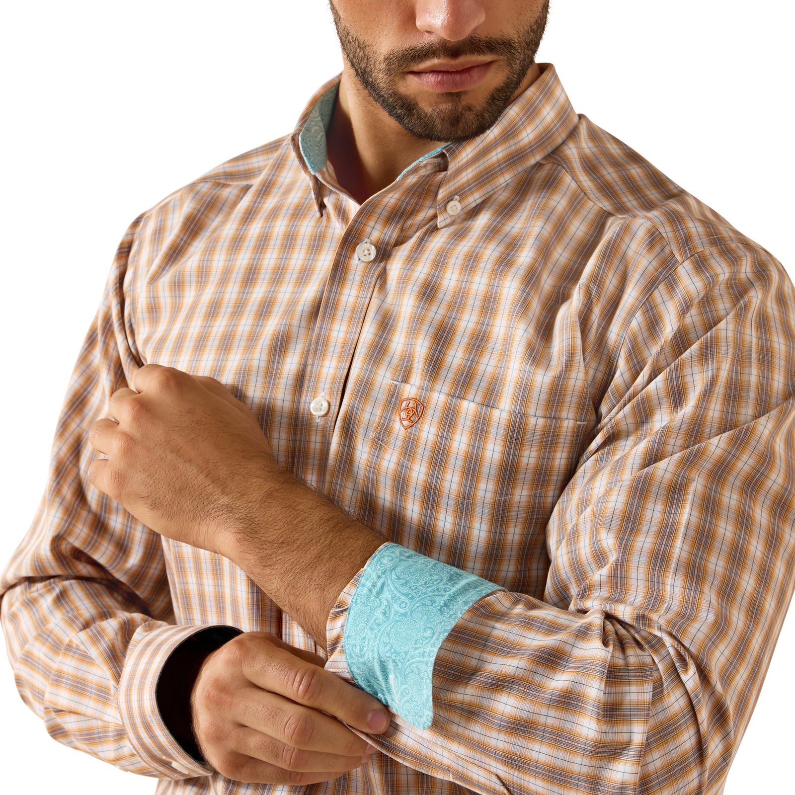 Man wearing a brown checkered shirt with a visible brand logo on a white background