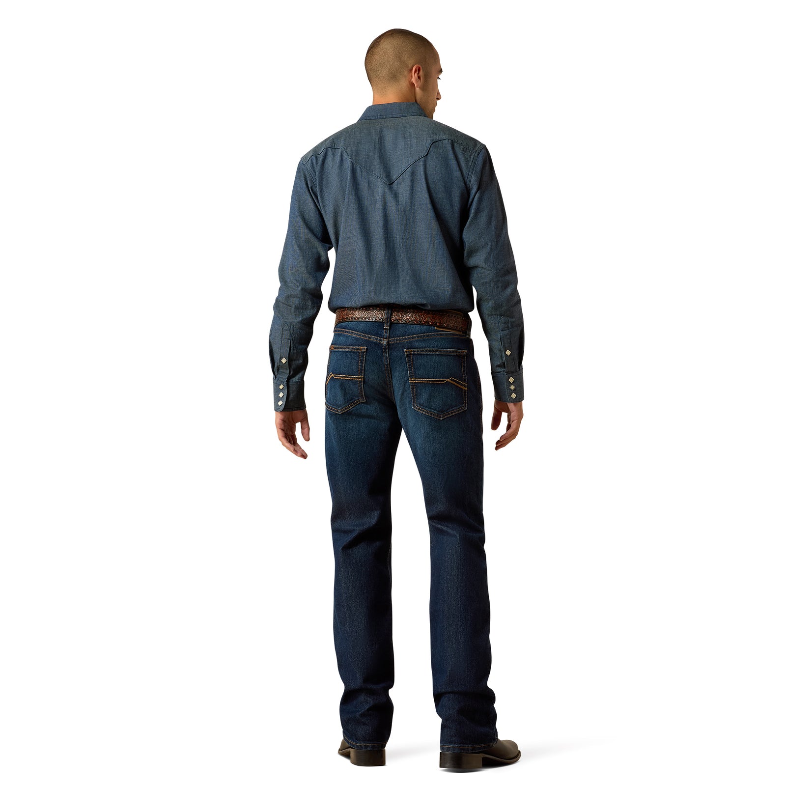 Man wearing a blue denim shirt and jeans on a white background