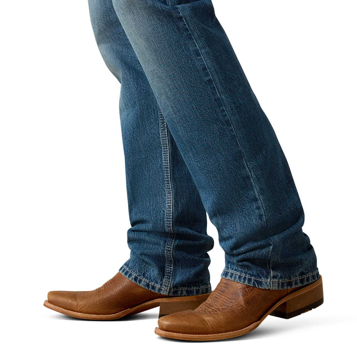 Blue jeans and brown boots on a white background