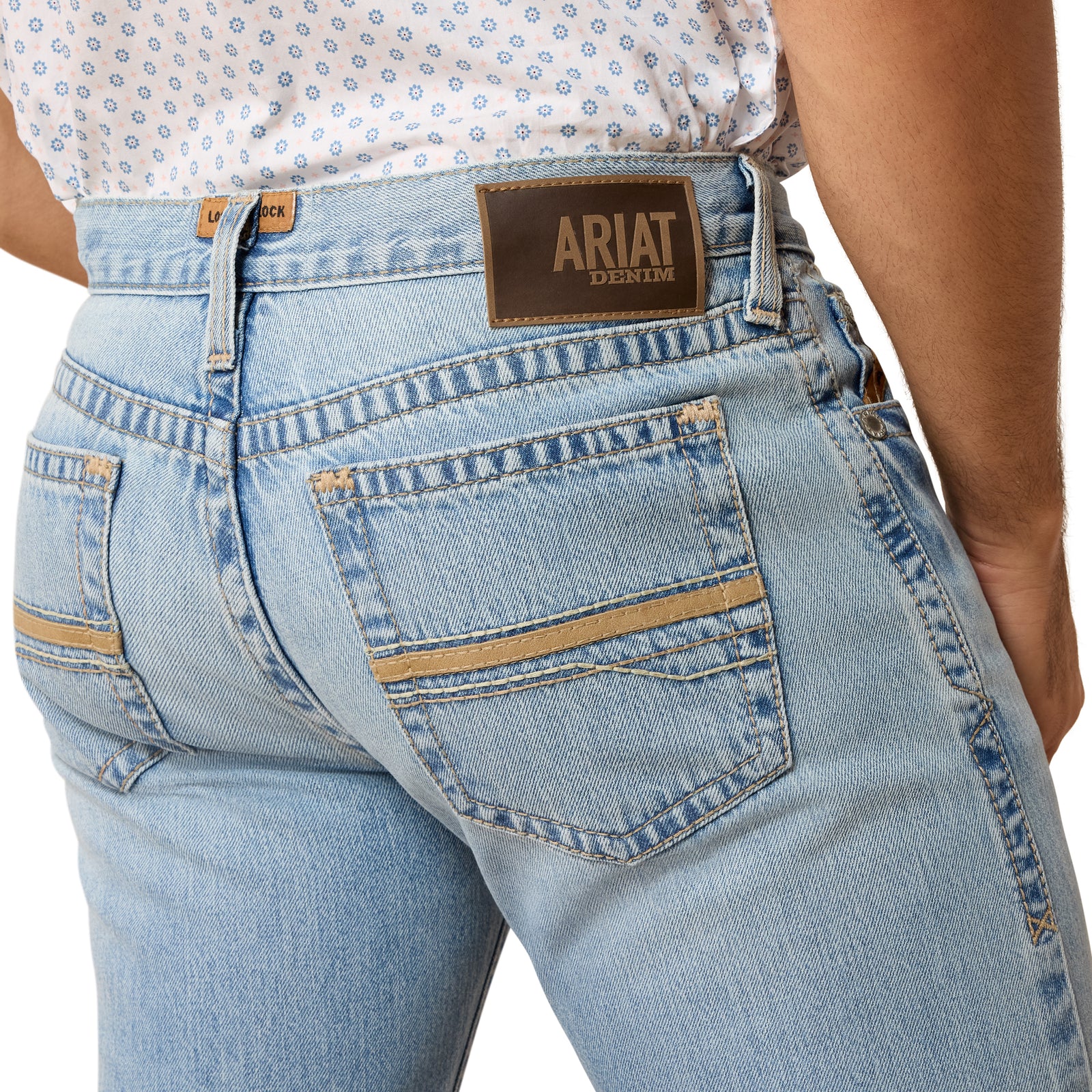 Light blue jeans with Ariat logo on a white background