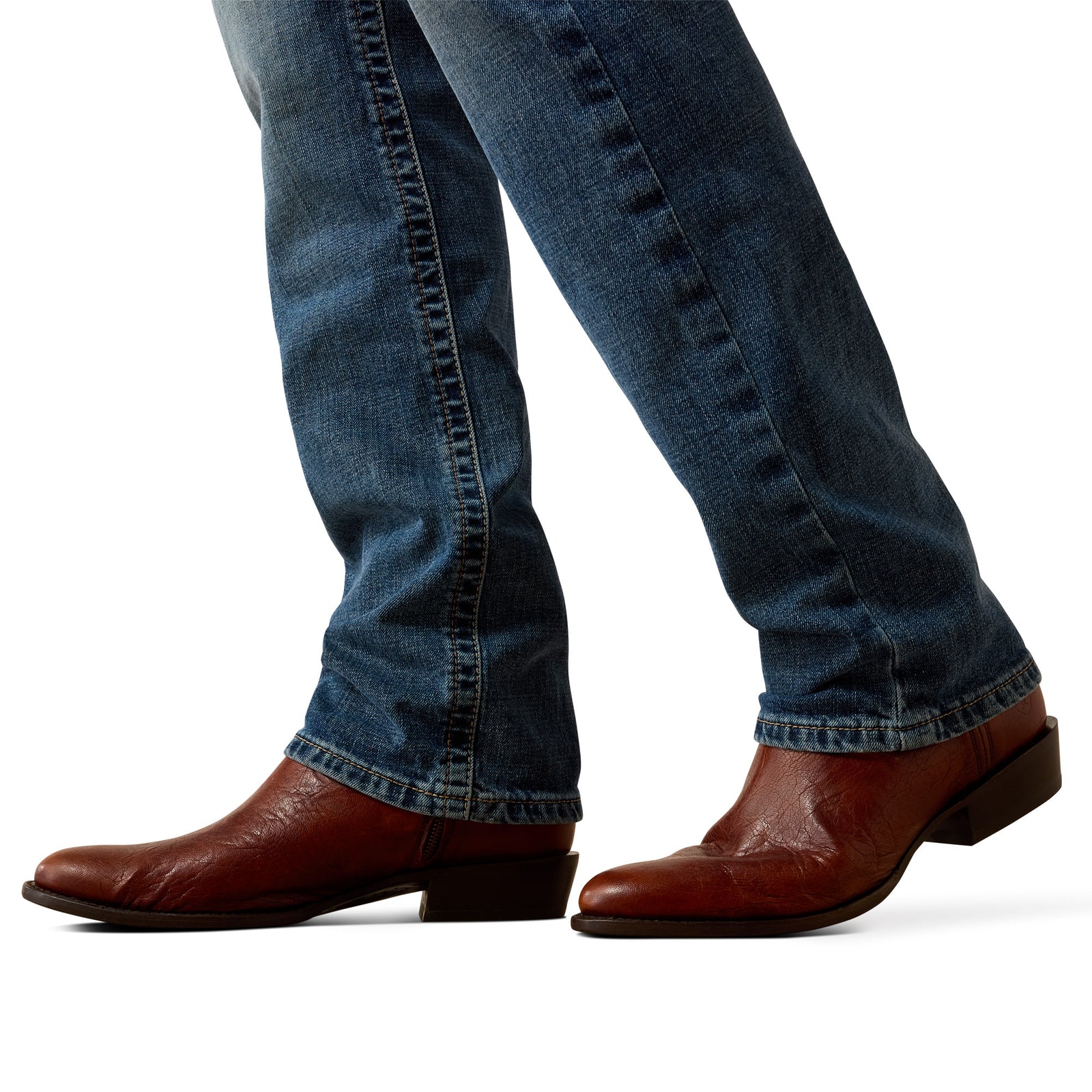 Brown leather boots and blue jeans on a white background