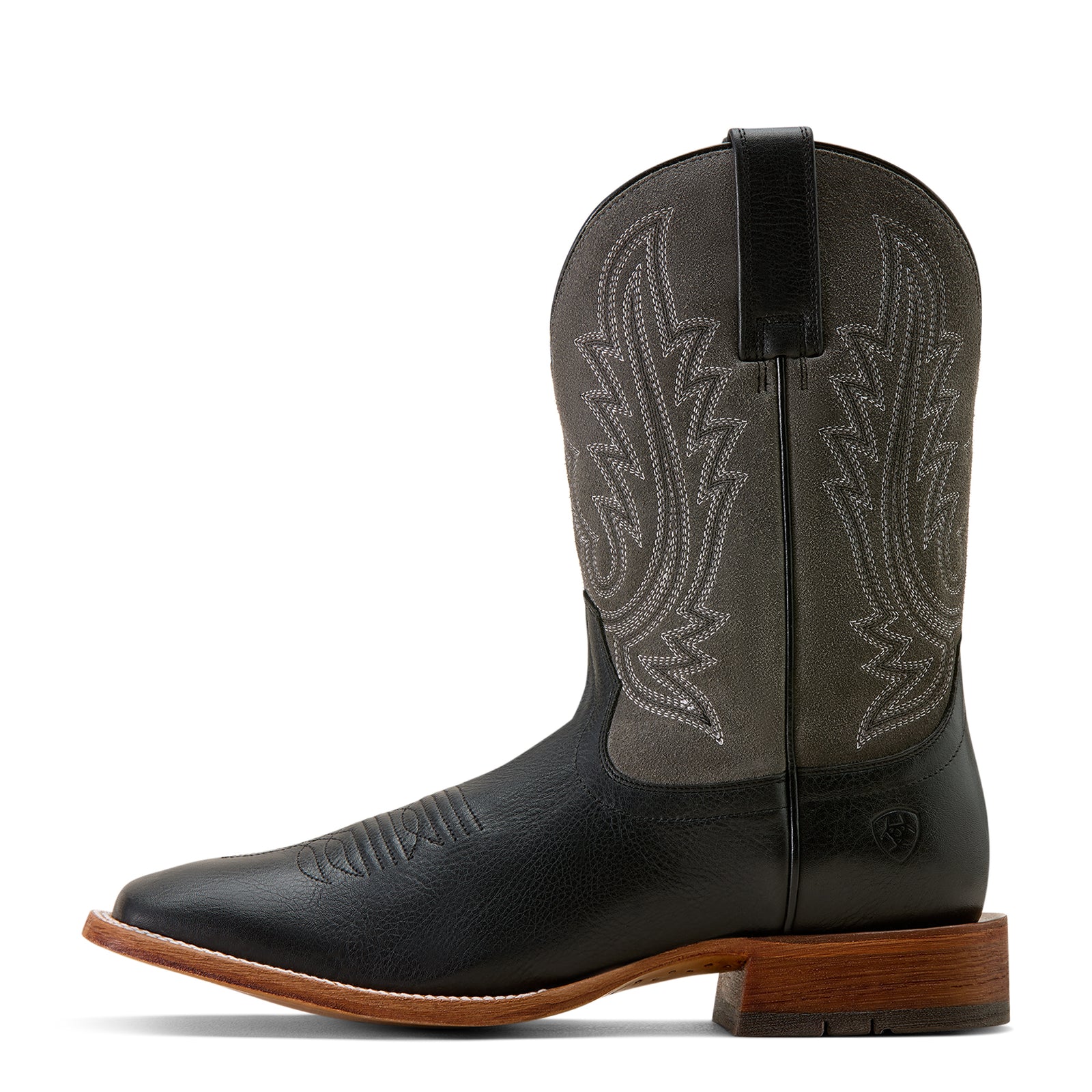 Black cowboy boot with brown sole on a white background