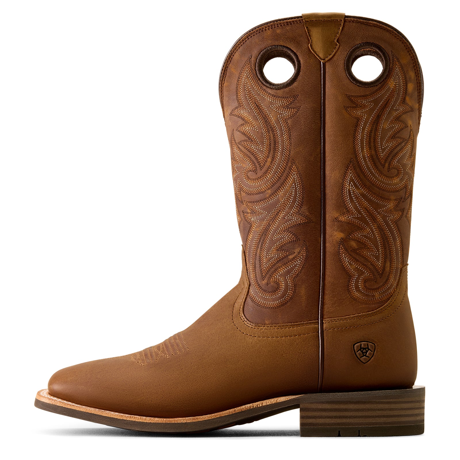 Brown cowboy boot with intricate leatherwork on a white background