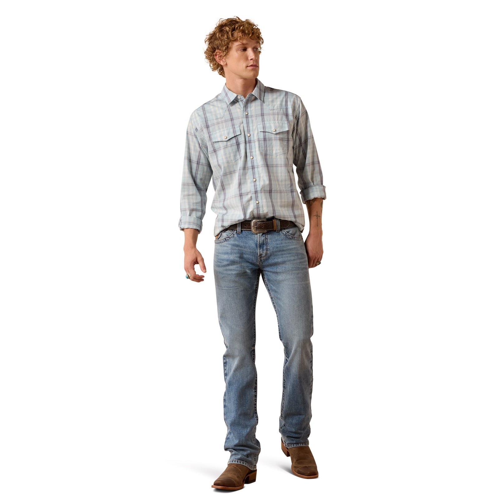 Man wearing a plaid shirt and jeans on a white background