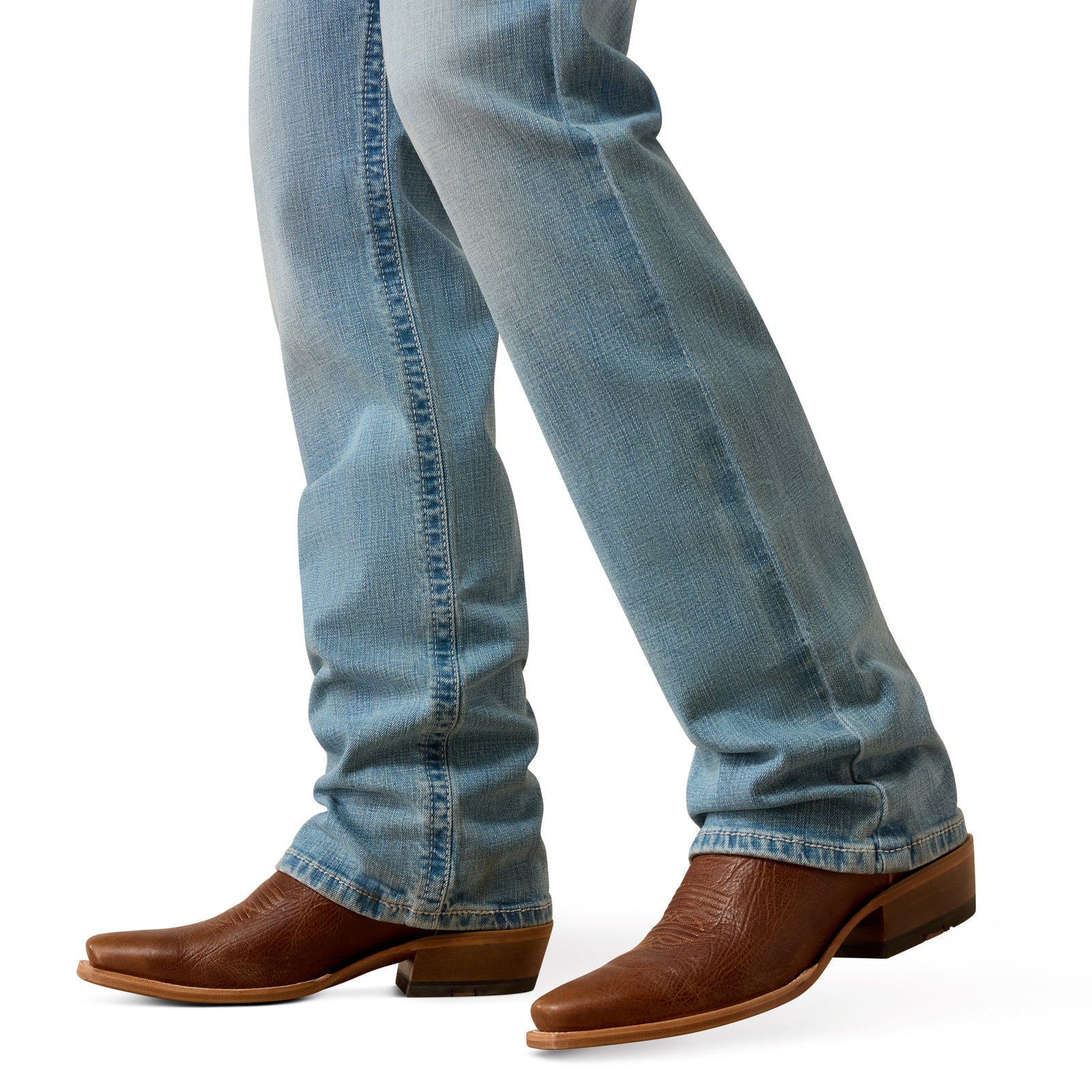 Blue jeans and brown boots on a white background