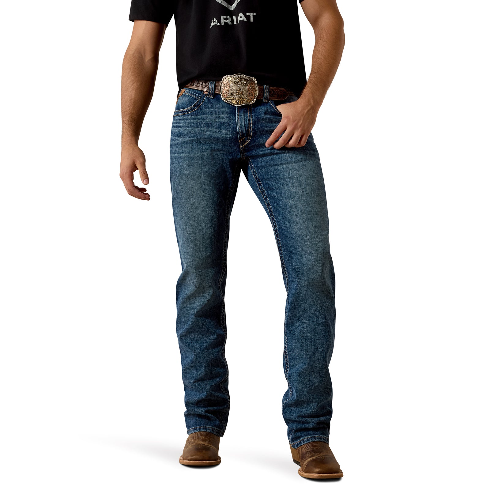 Person wearing blue jeans with a belt and brown boots on a white background