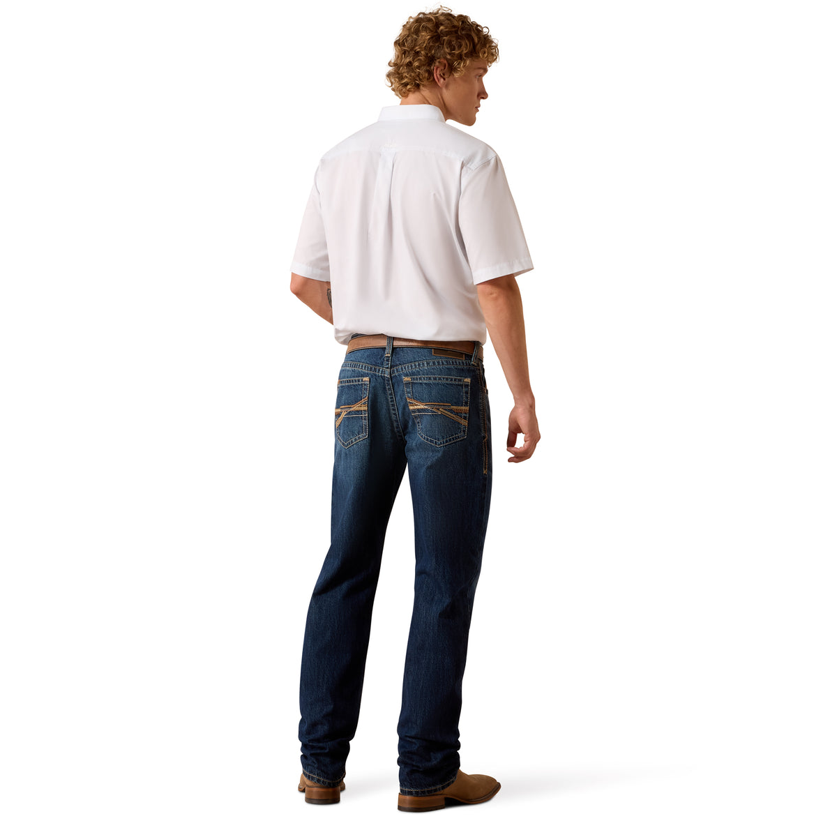 A man shown from the back wearing a white short-sleeve button-up shirt, dark blue jeans with contrast tan stitching on the back pockets, and brown boots, against a plain white background.