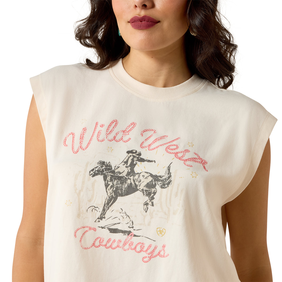Woman wearing a sleeveless shirt with 'Wild West Cowboys' graphic design.