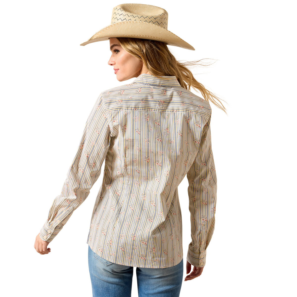 Woman wearing a patterned shirt and cowboy hat on a white background
