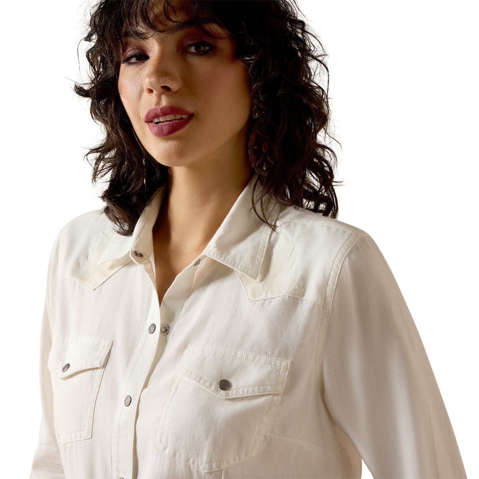 Woman wearing a white shirt against a white background