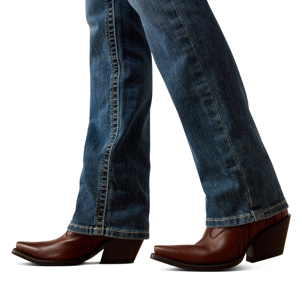 Close-up of blue jeans and brown cowboy boots on a white background