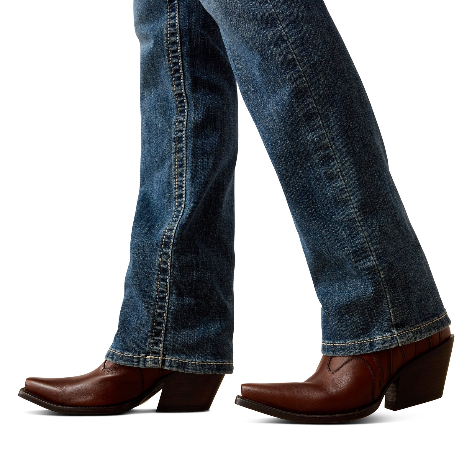 Close-up of blue jeans and brown cowboy boots on a white background