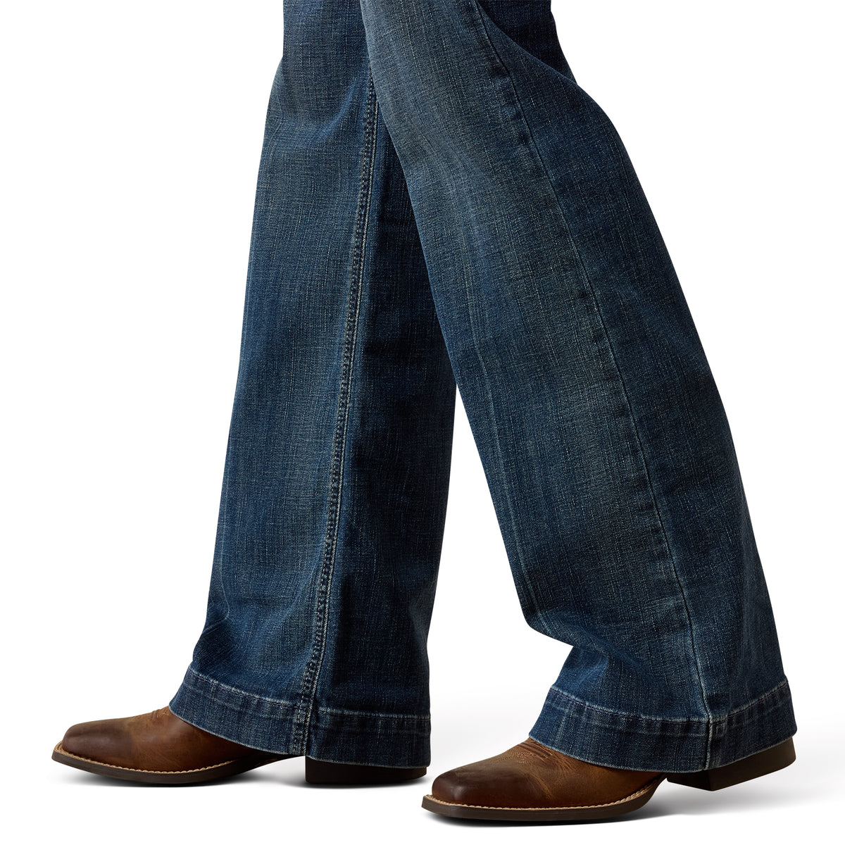 Blue jeans worn by a person on a white background
