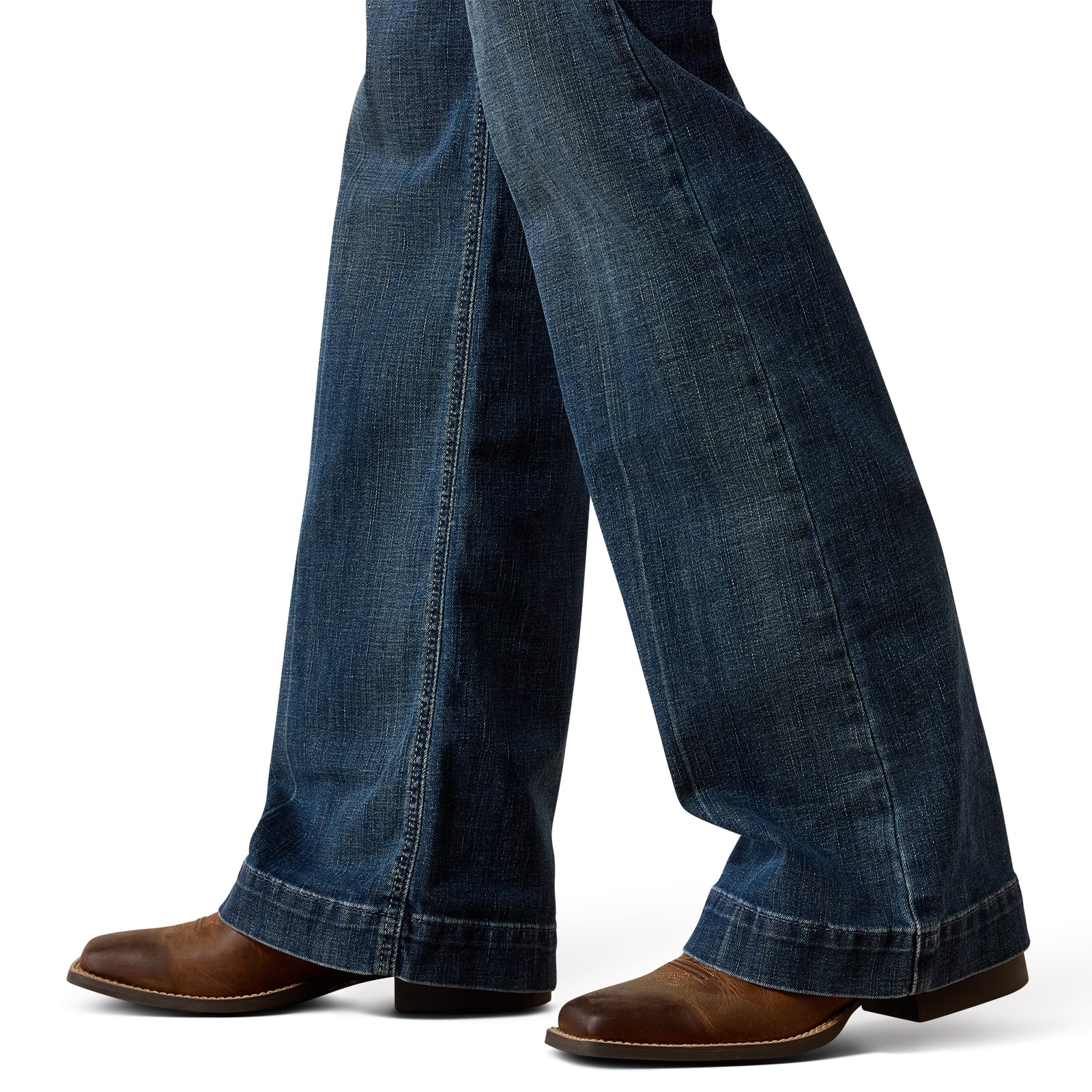 Blue jeans worn by a person on a white background