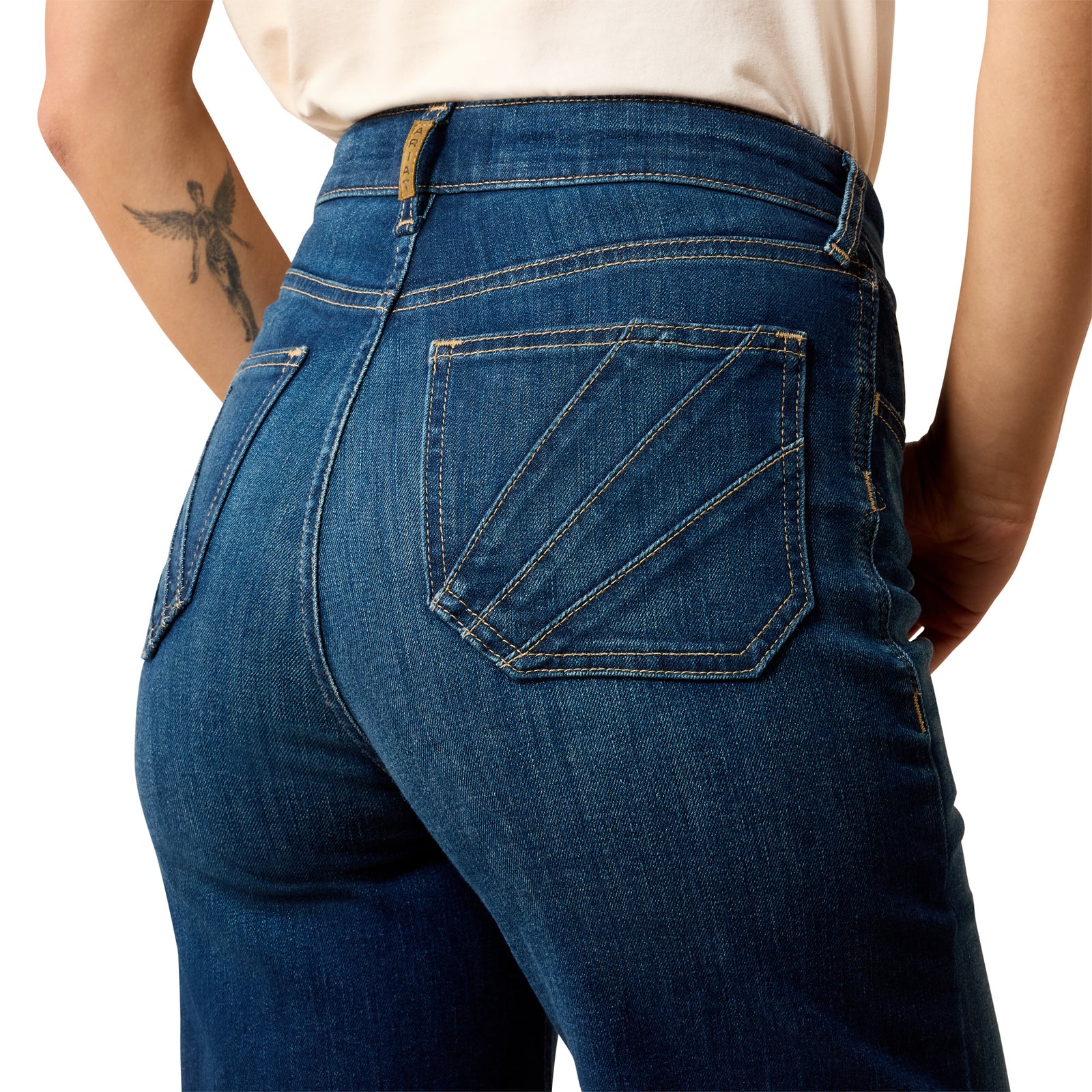 Blue jeans worn by a person on a white background