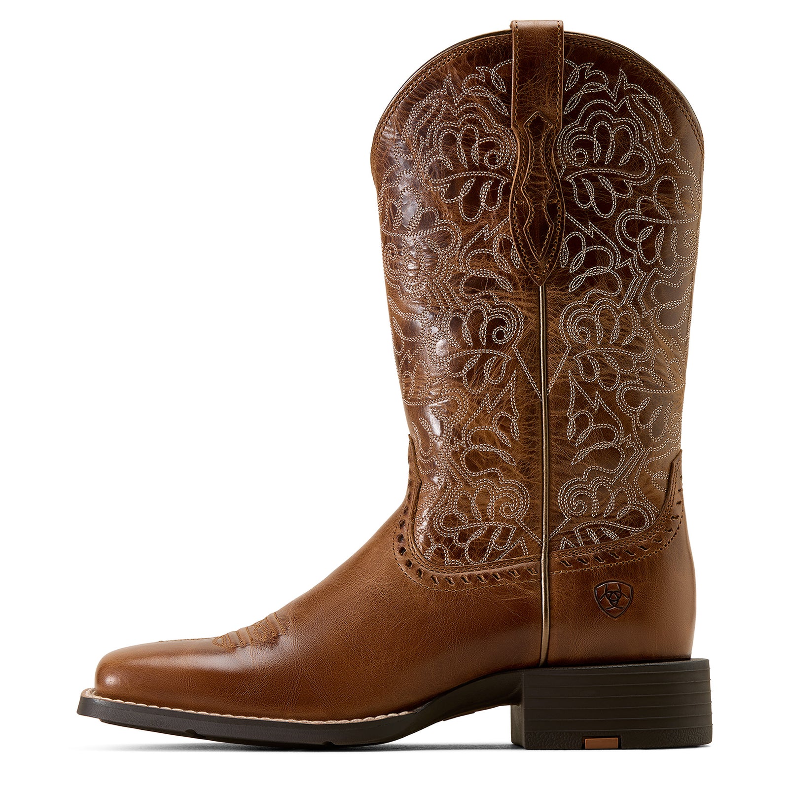 Brown cowboy boot with intricate white embroidery on a white background