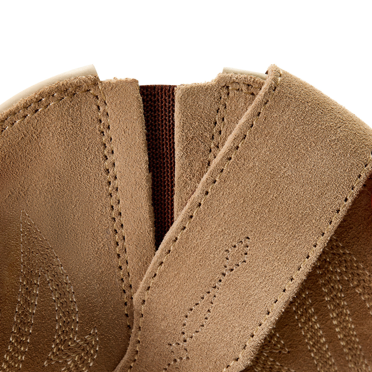 Close-up of brown leather shoe with stitching detail