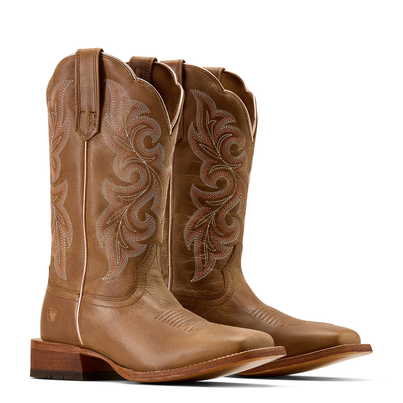 Pair of brown cowboy boots with intricate designs on a white background