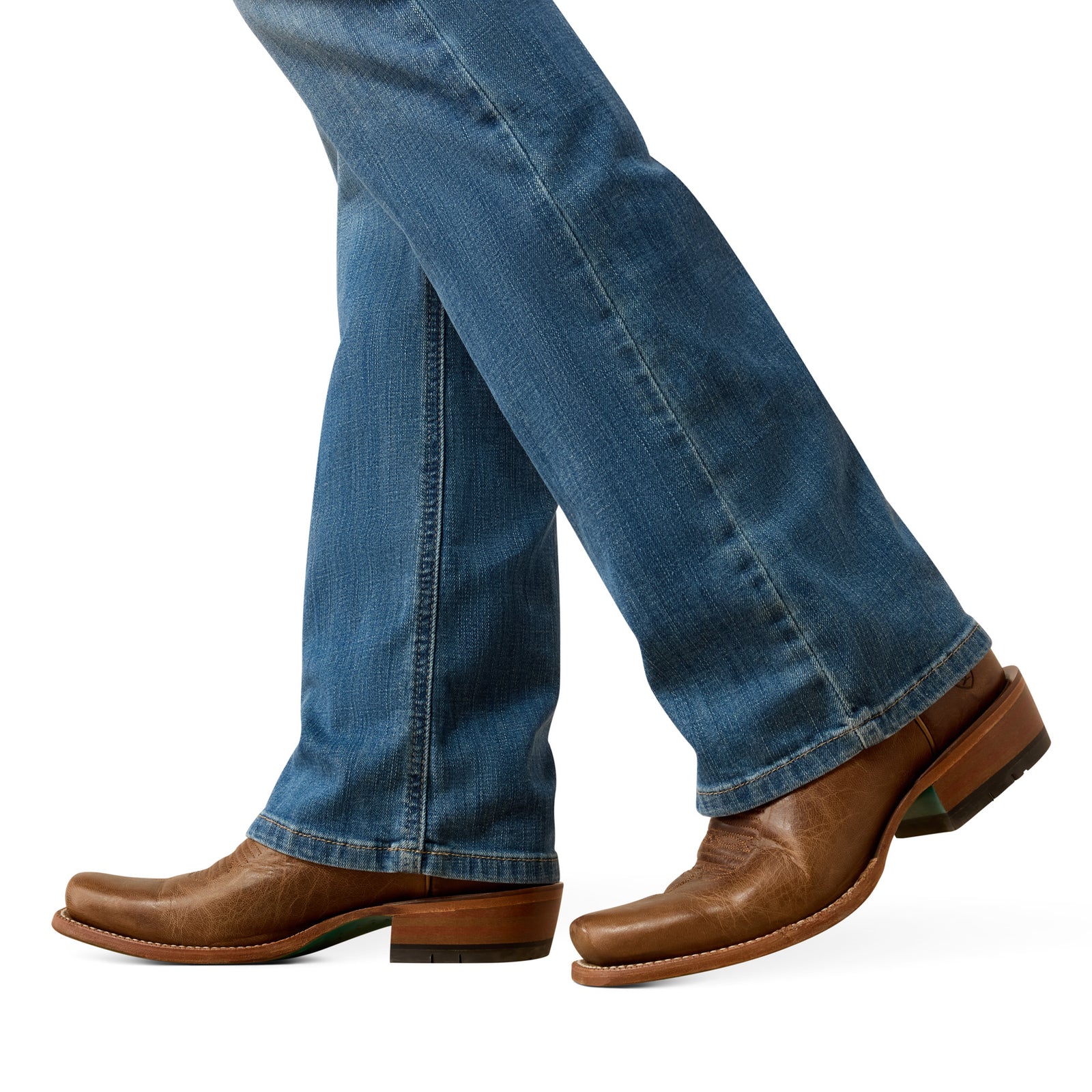 Brown leather boots and blue jeans on a white background