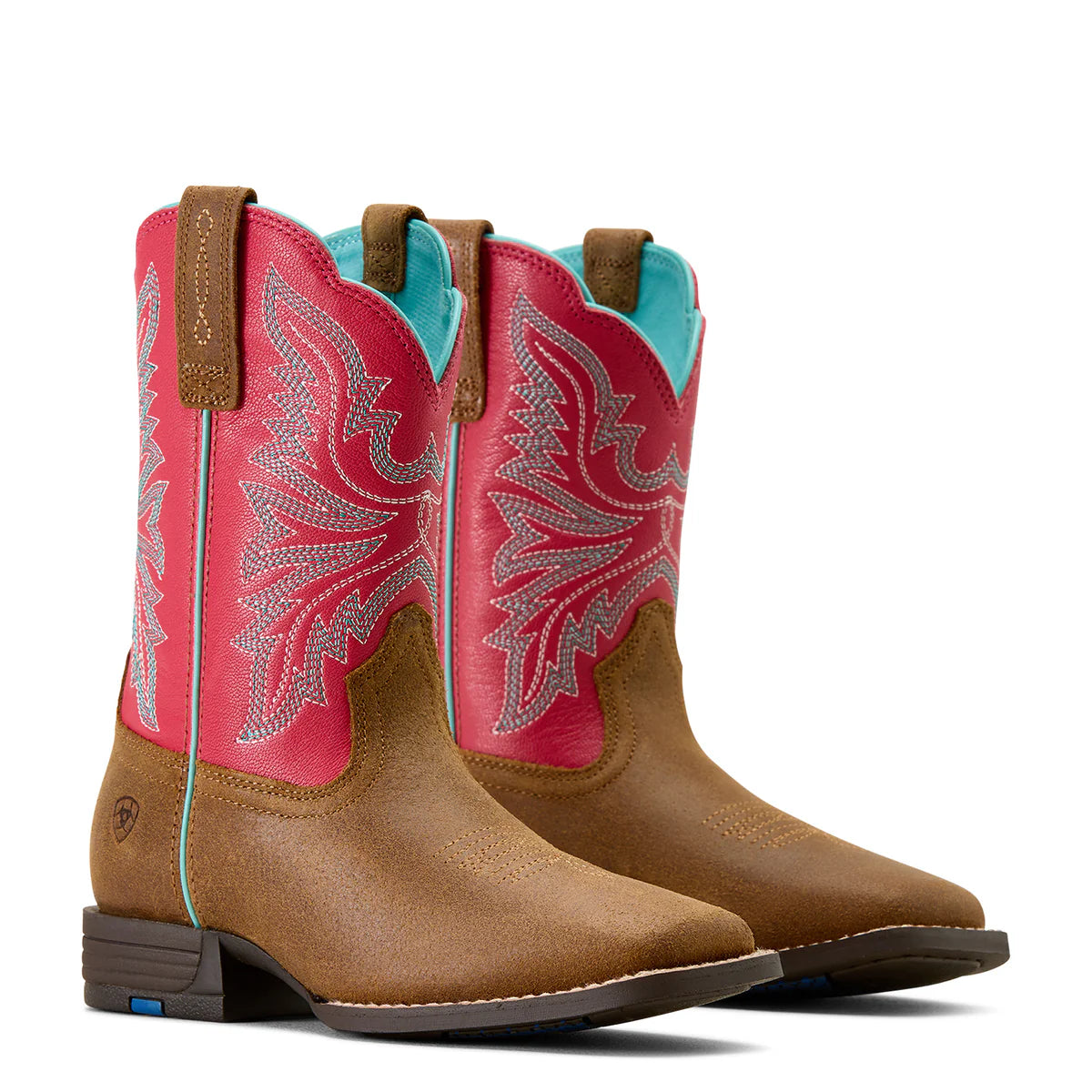 Pair of cowboy boots with pink uppers and brown shafts on a white background