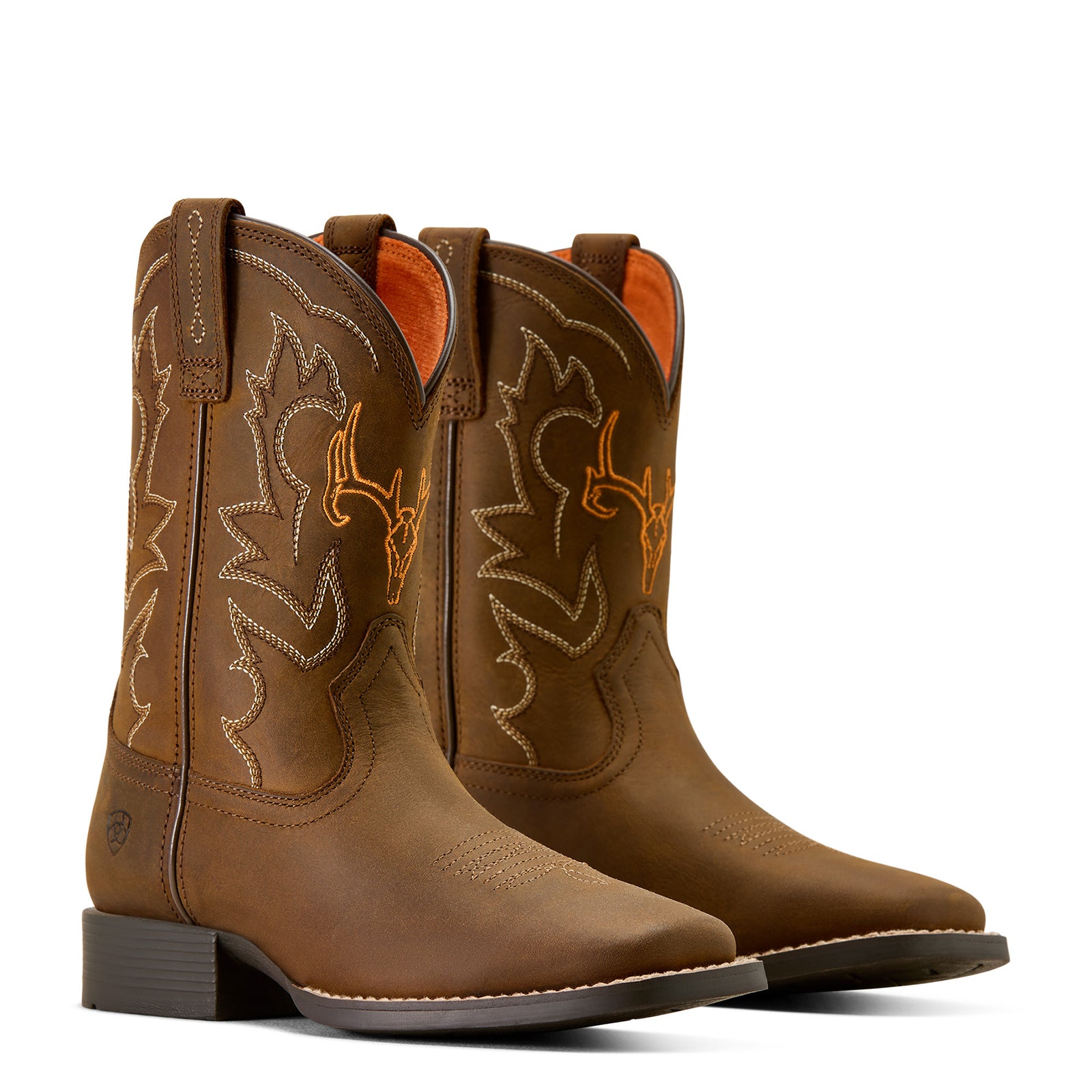 Pair of brown cowboy boots with intricate stitching on a white background